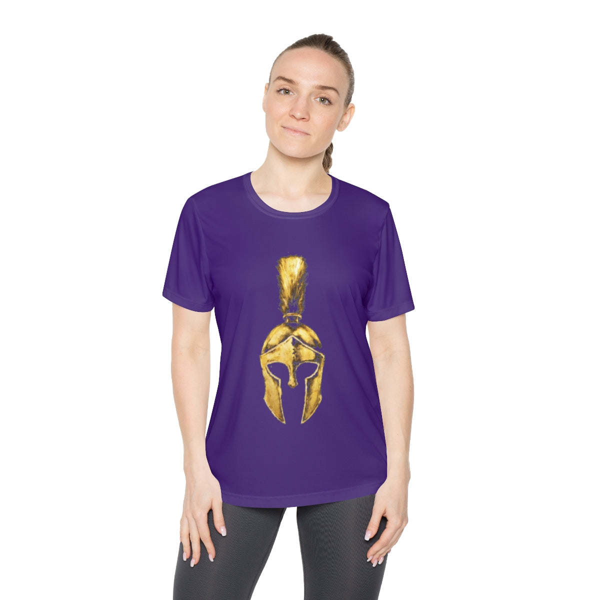 Woman wearing purple women's performance tee with the gold Praetorian helmet on the front