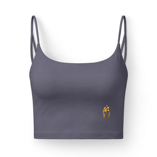 Charcoal women's sports bra with a small gold Helm helmet on the front