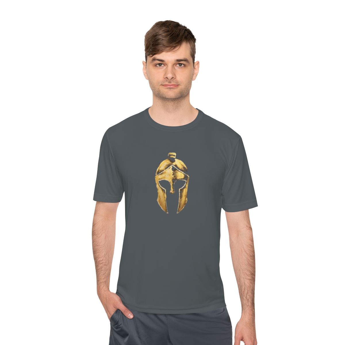 Man wearing iron grey performance tee with the gold Helm helmet on the front
