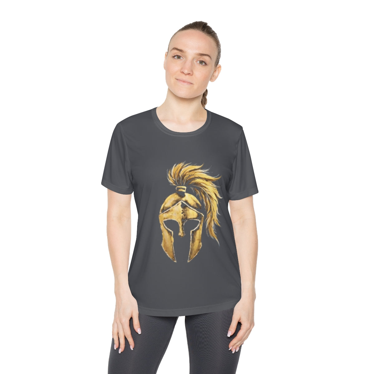 Woman wearing iron grey women's performance tee with the gold Aquila helmet on the front