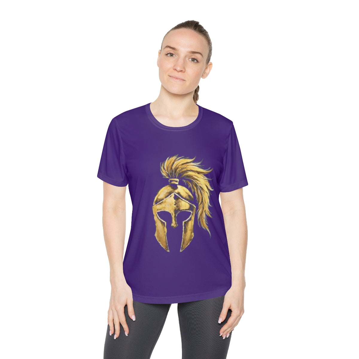 Woman wearing purple women's performance tee with the gold Aquila helmet on the front