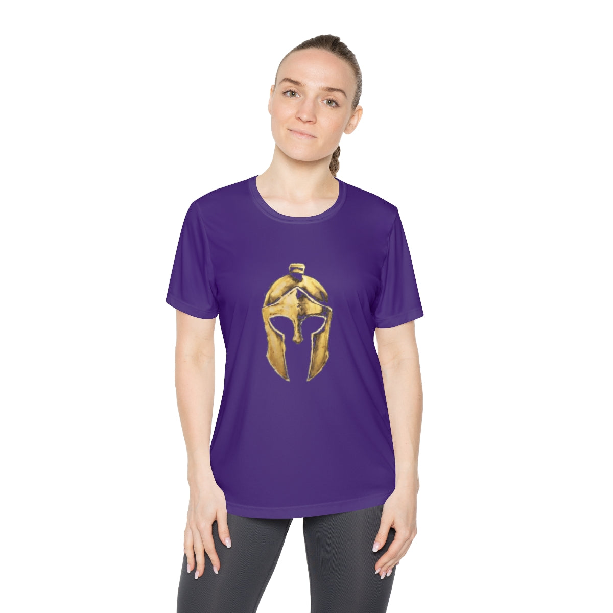 Woman wearing purple women's performance tee with the gold Helm helmet on the front