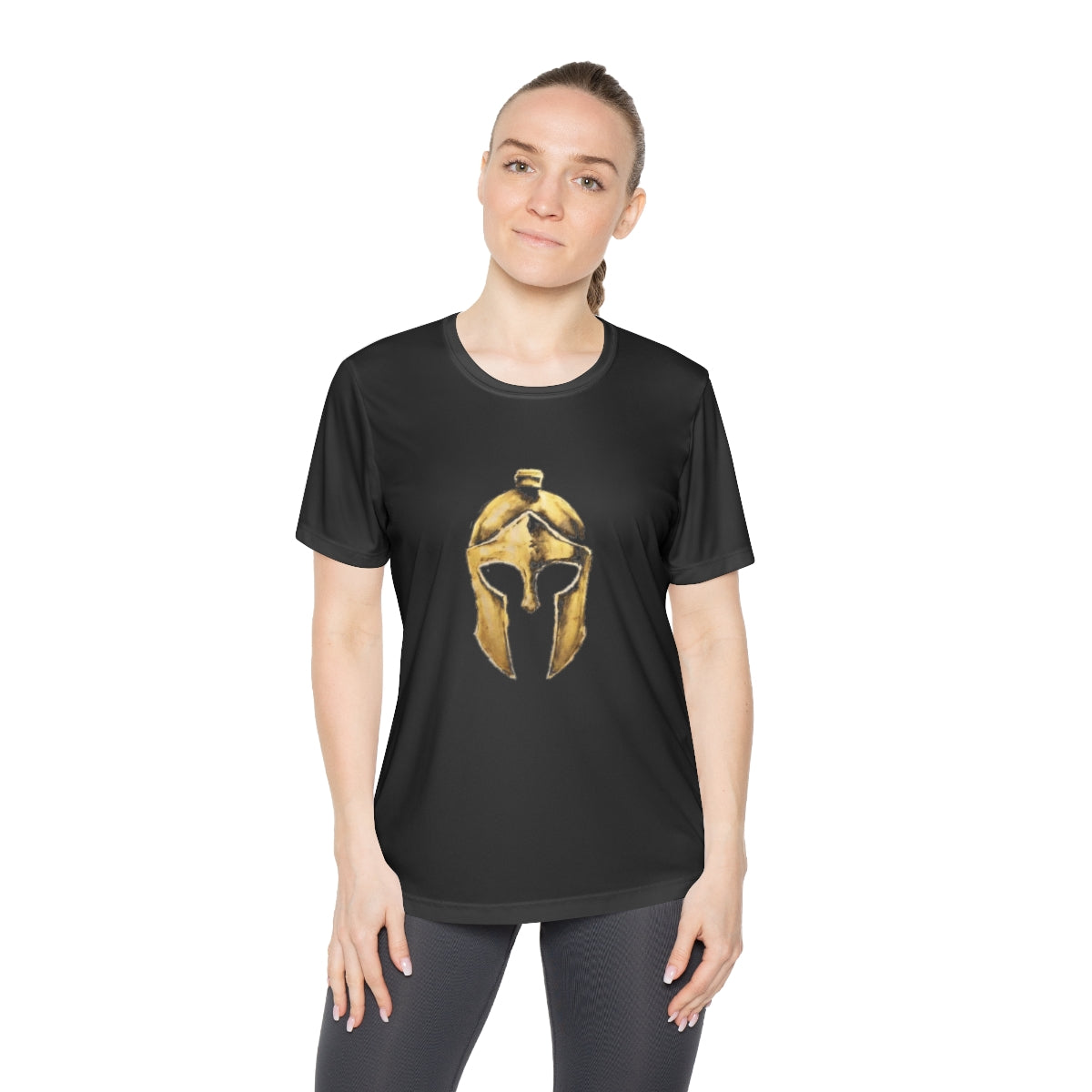 Woman wearing black women's performance tee with the gold Helm helmet on the front