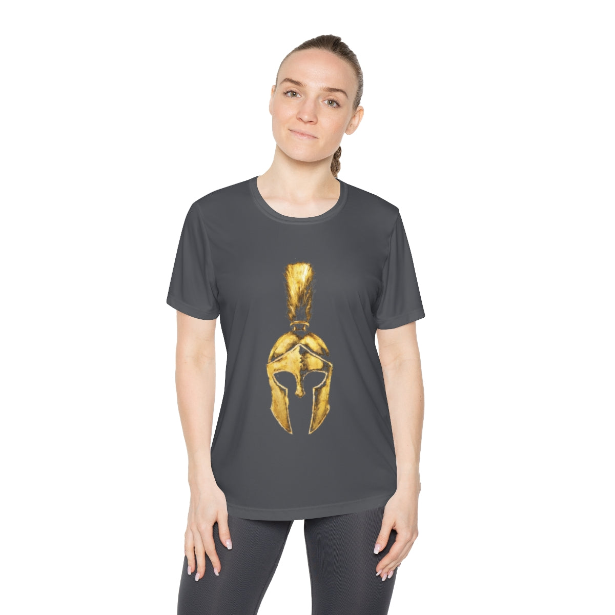 Woman wearing iron grey women's performance tee with the gold Praetorian helmet on the front